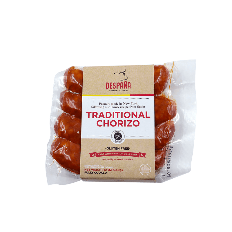 A packet of Despaña Traditional Chorizo. Four ruby red chorizo links, vacuum sealed with Despaña branding on the packaging. This chorizo is proudly made in New York following our family recipe from Spain.